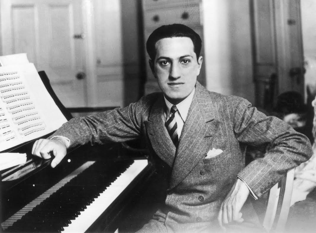 Songwriter George Gershwin (1898 - 1937) at a piano. (Photo by Evening Standard/Getty Images)
