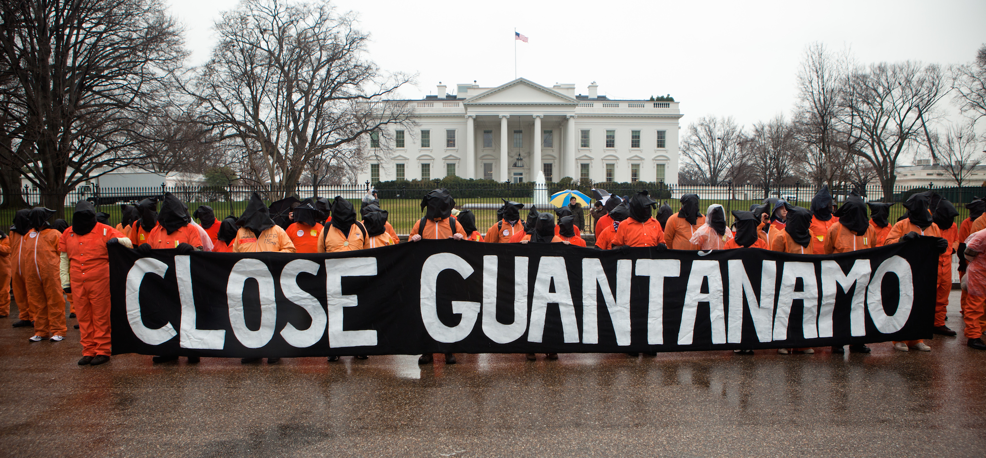 Amnesty International USA activists, holding a banner that says 'Close Guantanamo, protest the 10th anniversary of the Guantanamo Bay detention centre, in front of the White House, Washington DC, USA, 11 January 2012.