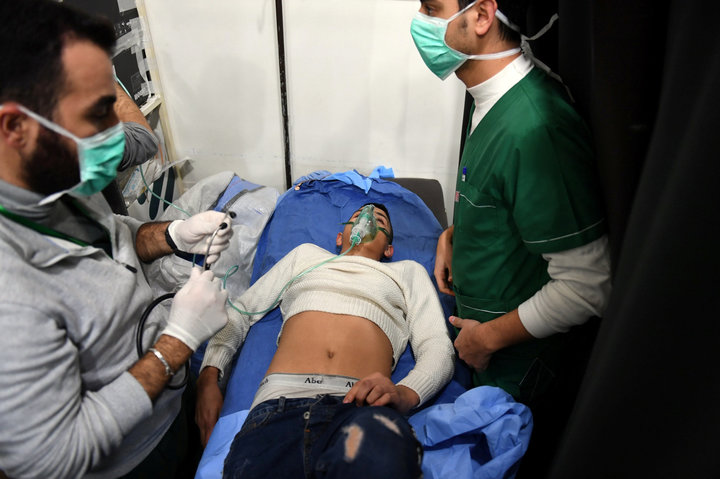 A man breathes through an oxygen mask inside a hospital after what the Syrian state media said was a suspected toxic gas attack in Aleppo, Syria November 24, 2018. Picture taken November 24, 2018. SANA/Handout via REUTERS ATTENTION EDITORS - THIS IMAGE WAS PROVIDED BY A THIRD PARTY. REUTERS IS UNABLE TO INDEPENDENTLY VERIFY THIS IMAGE