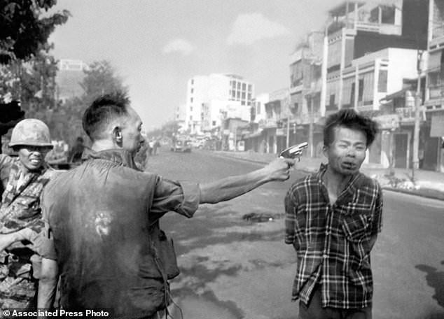 FILE - In this Feb. 1, 1968, file photo, South Vietnamese Gen. Nguyen Ngoc Loan, chief of the National Police, fires his pistol into the head of suspected Viet Cong officer Nguyen Van Lem (also known as Bay Lop) on a Saigon street, early in the Tet Offensive. Early on the morning of Jan. 31, 1968, as Vietnamese celebrated the Lunar New Year, or Tet as it is known locally, Communist forces launched a wave of coordinated surprise attacks across South Vietnam. The campaign, one of the largest of the Vietnam War, led to intense fighting and heavy casualties in cities and towns across the South. (AP Photo/Eddie Adams, File)
