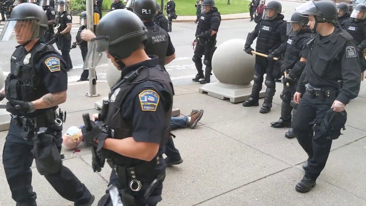 Two Buffalo police officers shove a man to the ground in front of City Hall WARNING GRAPHIC